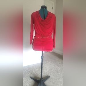 Red cowl neck ruched top with gold and red chain belt